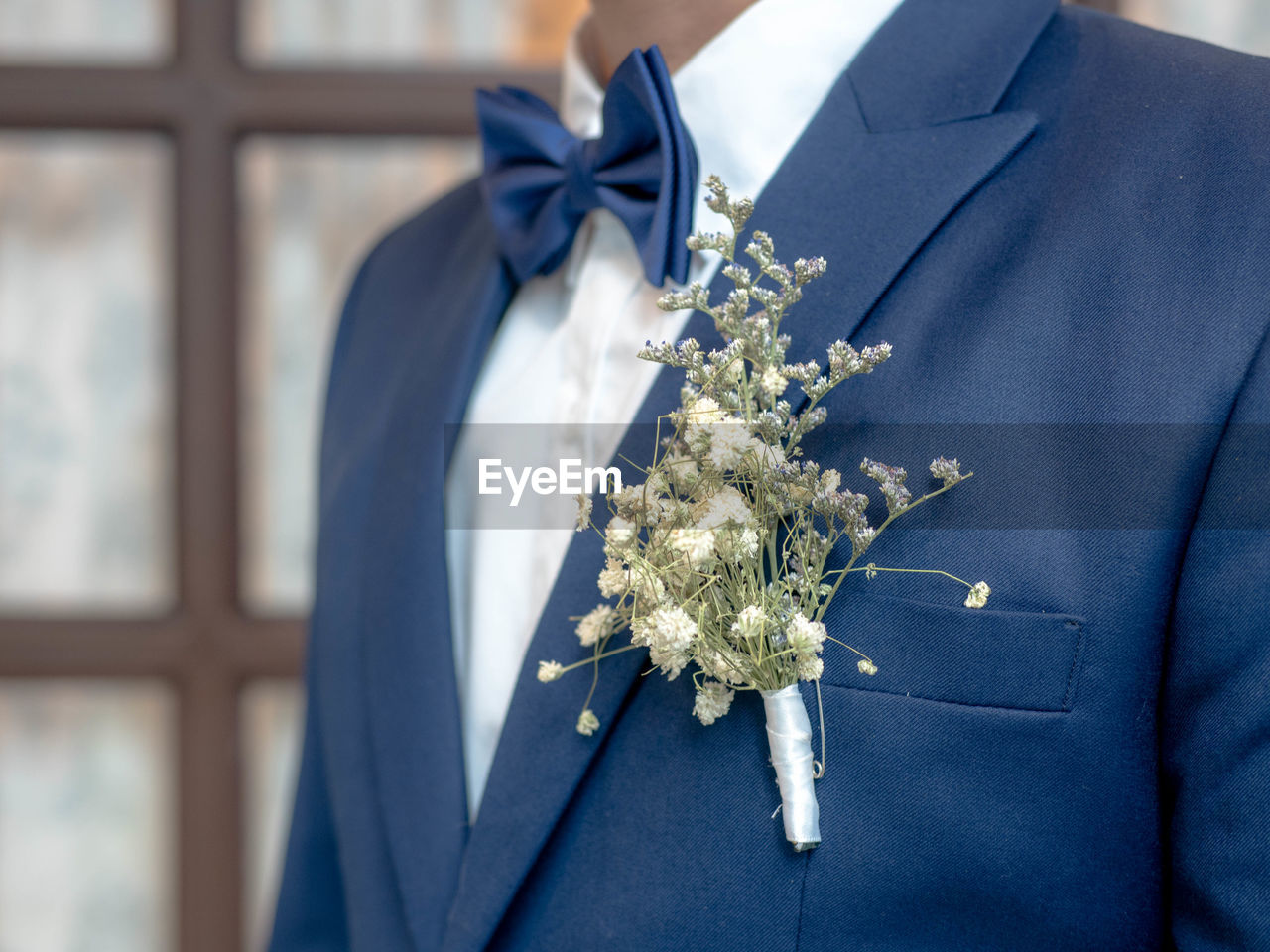 Midsection of bridegroom wearing suit