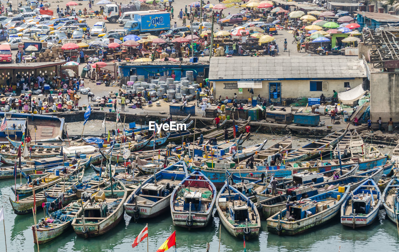 HIGH ANGLE VIEW OF BOATS MOORED IN HARBOR