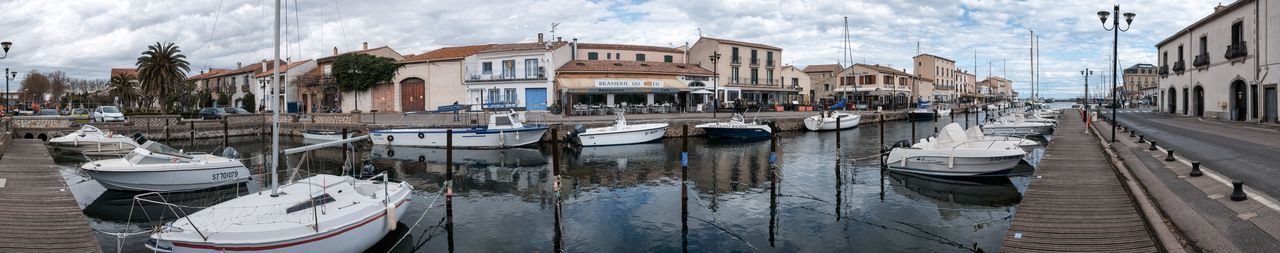 BOATS MOORED IN HARBOR