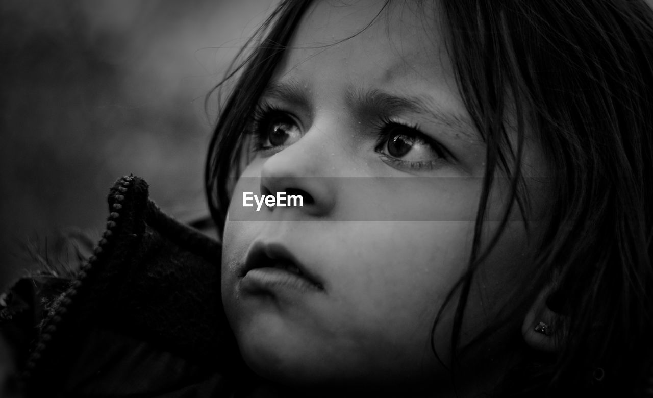 Close-up of girl looking away