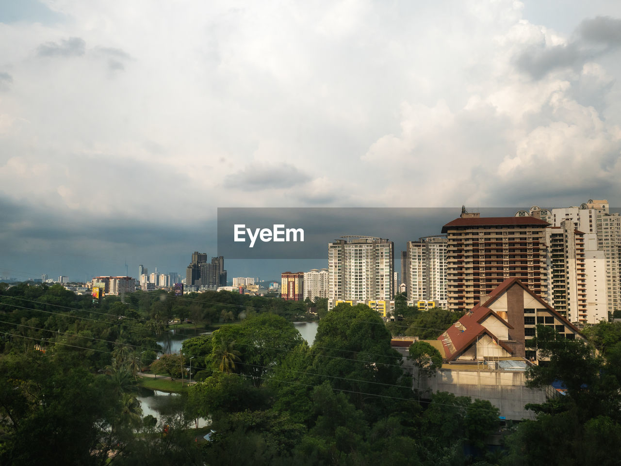 architecture, building exterior, built structure, city, building, sky, cloud, skyline, cityscape, urban area, nature, tree, residential district, horizon, landscape, urban skyline, plant, office building exterior, travel destinations, no people, skyscraper, outdoors, travel, city life, environment, residential area, house, downtown, tourism, landmark, high angle view, business finance and industry