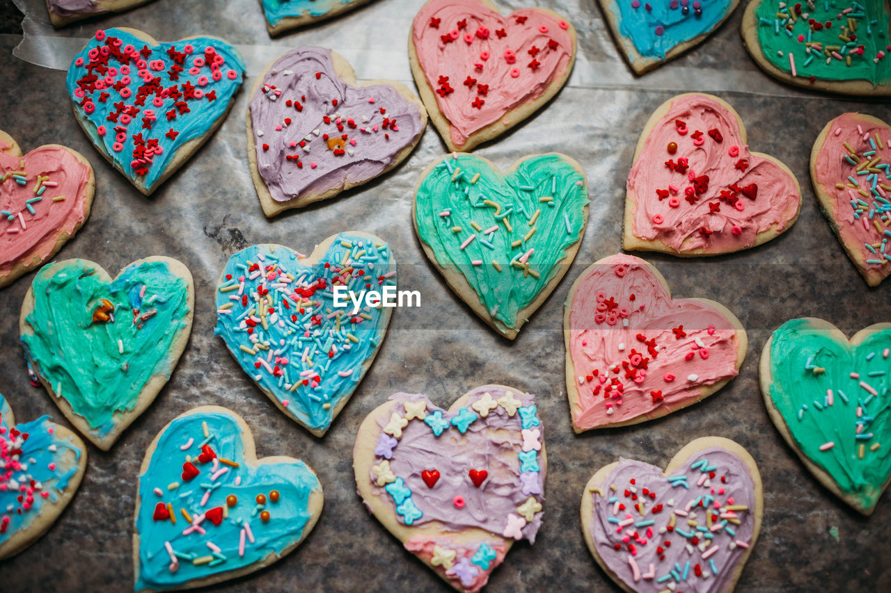 Colorful heart shaped valentines cookies with sprinkles