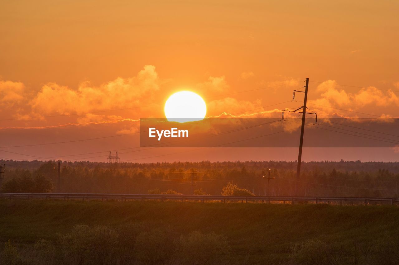 SCENIC VIEW OF SUNSET OVER LAND