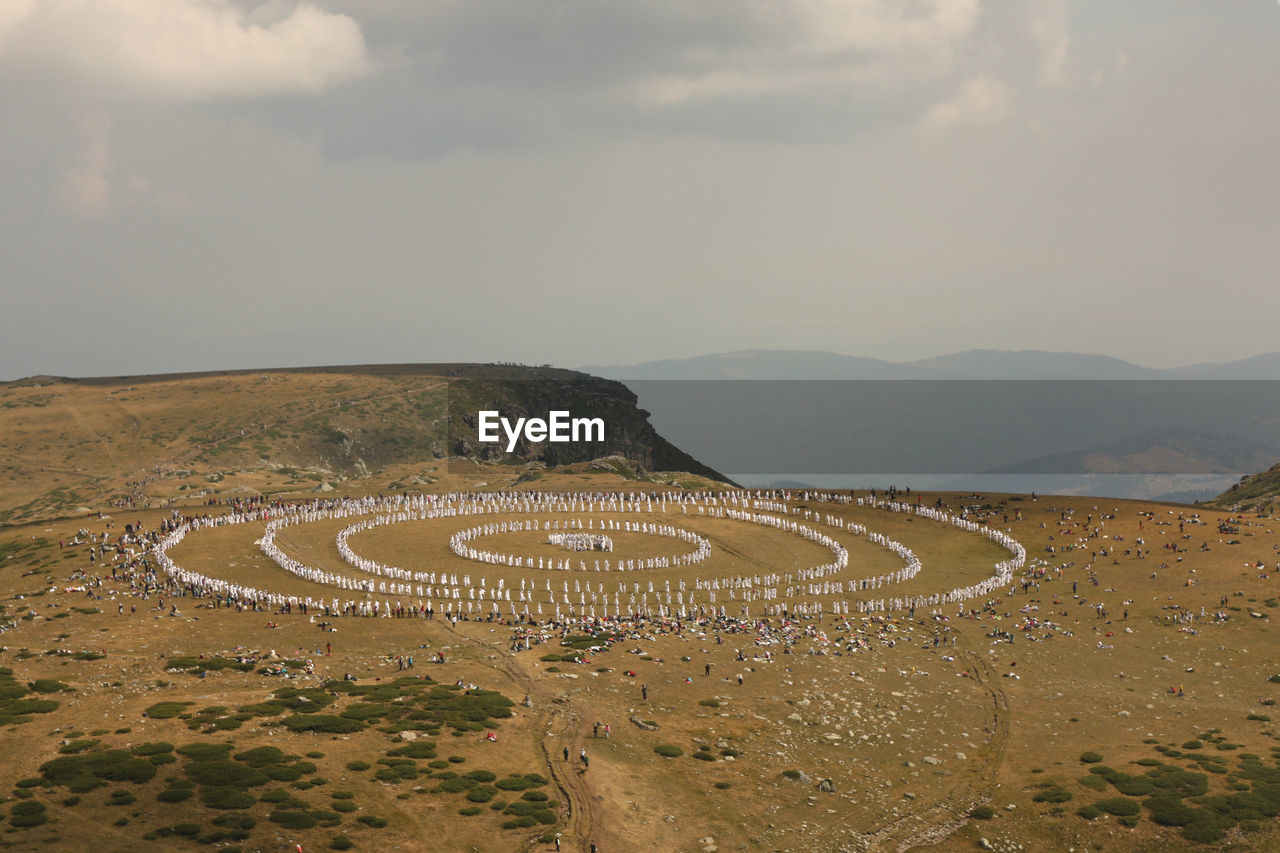 HIGH ANGLE VIEW OF LAND AGAINST SKY