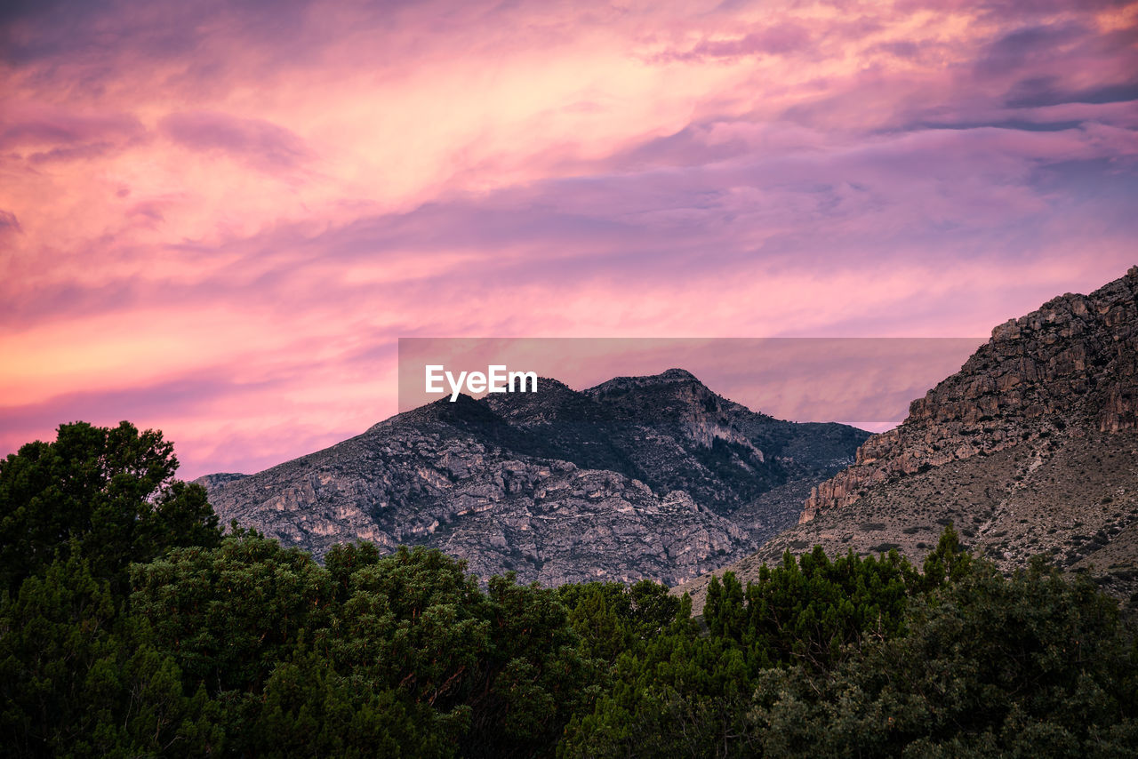 Scenic view of mountains against sky during sunset
