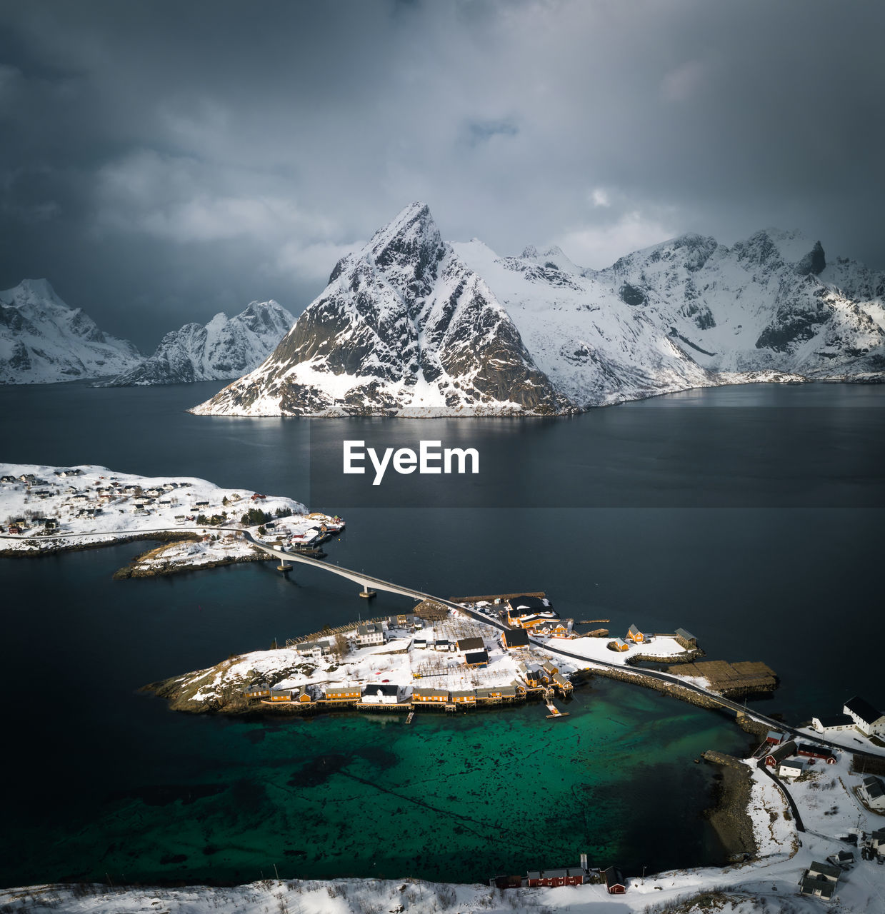 AERIAL VIEW OF SNOWCAPPED MOUNTAINS AGAINST SKY