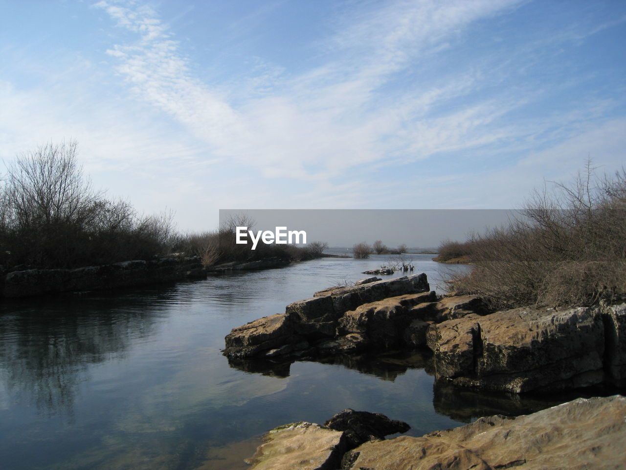 Scenic view of river against sky