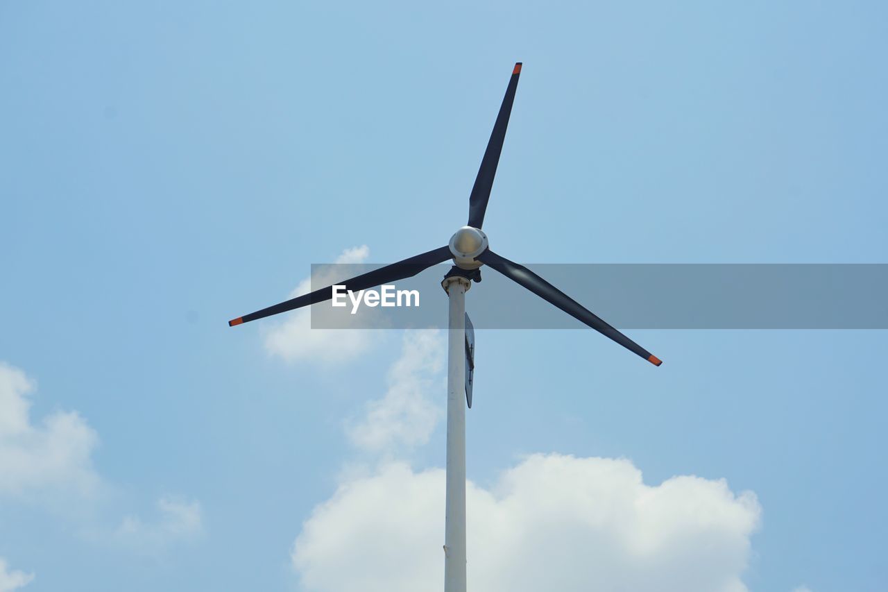 Low angle view of wind turbine against sky