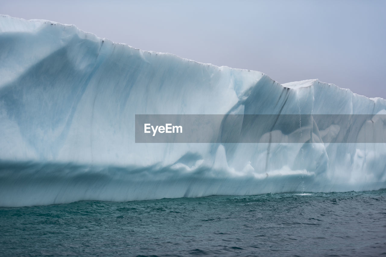 Scenic view of glacier against sky