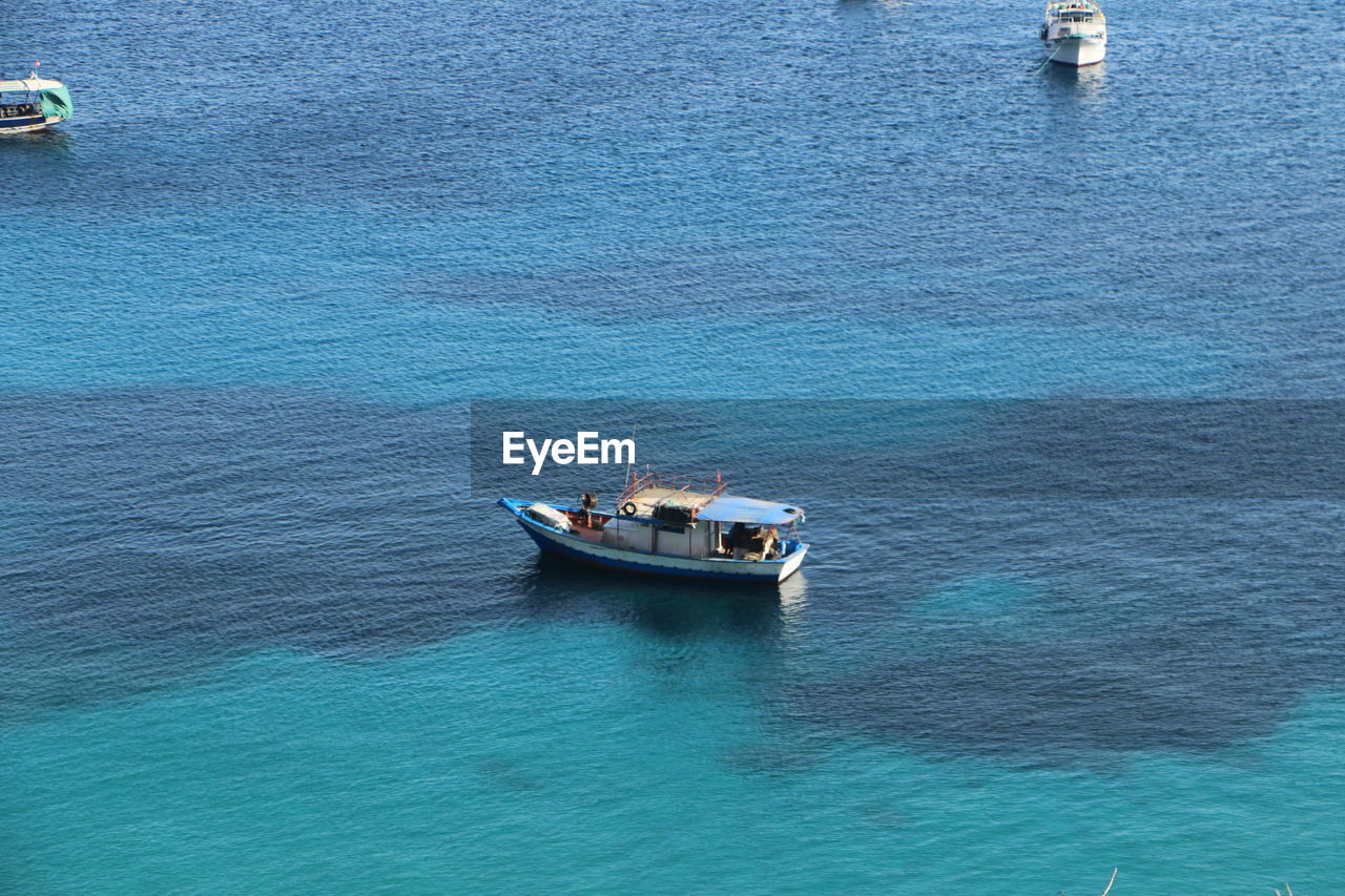 Boats sailing in sea