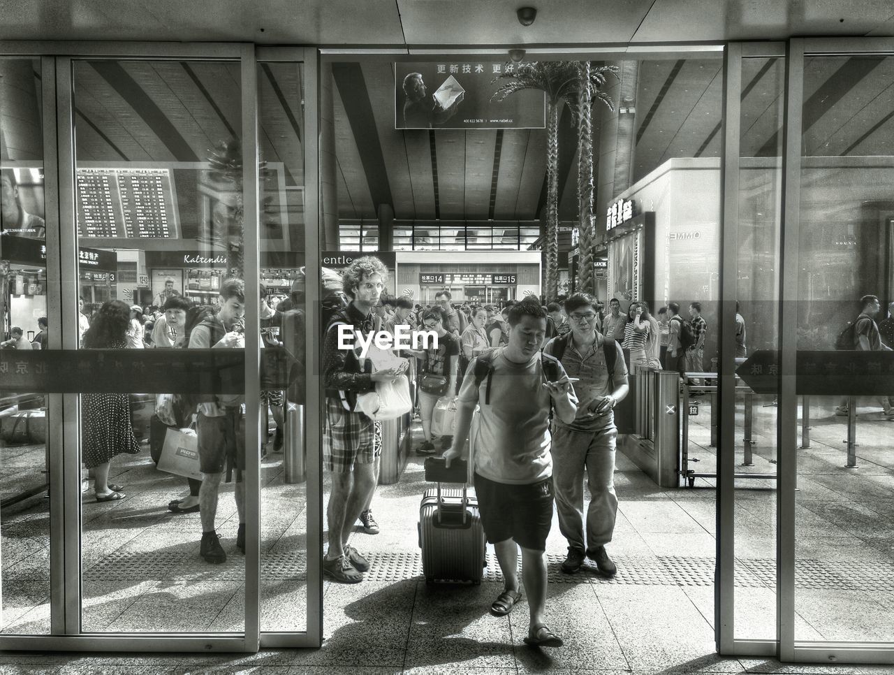 PEOPLE ON FLOOR IN SHOPPING MALL