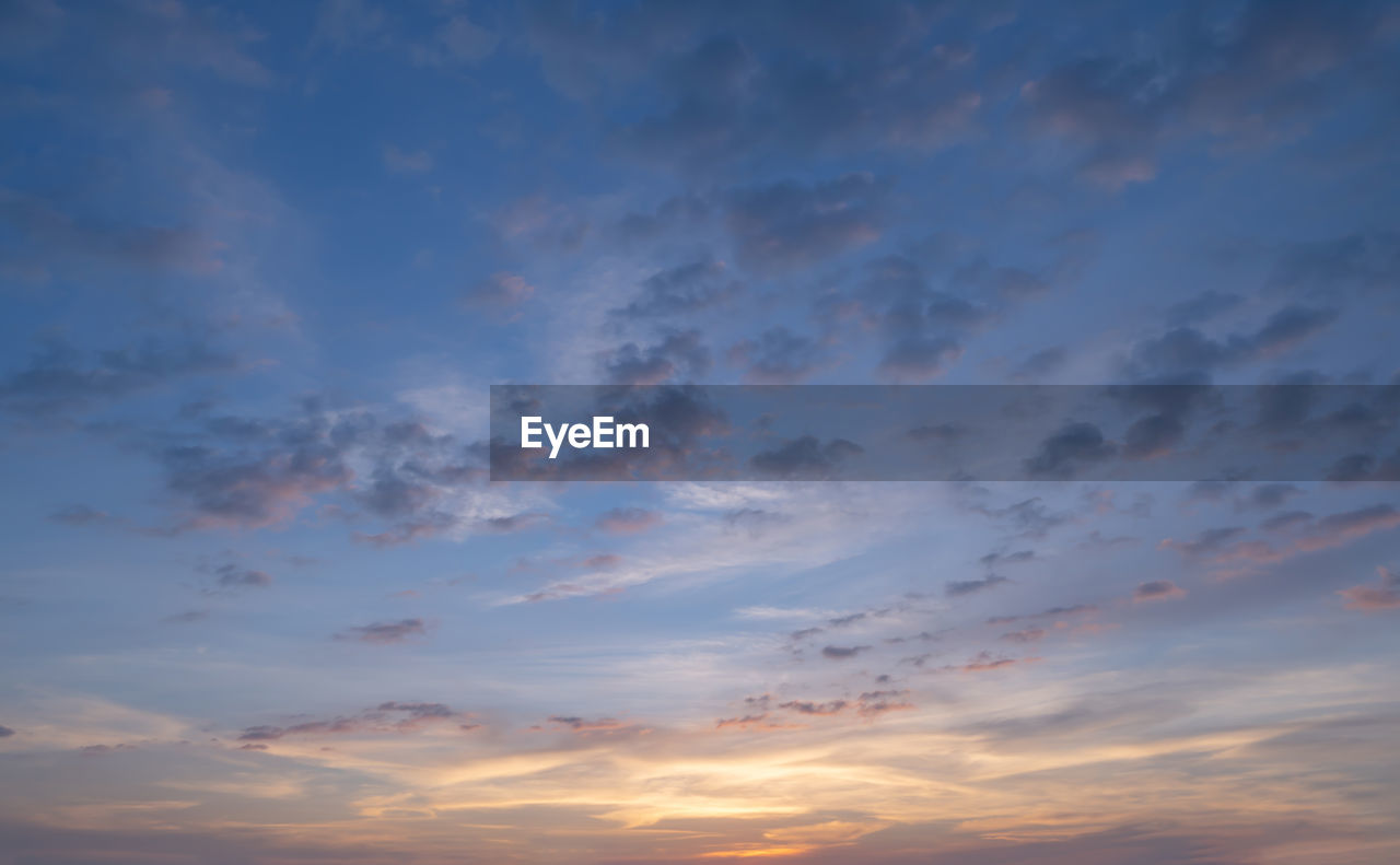 LOW ANGLE VIEW OF CLOUDY SKY AT SUNSET