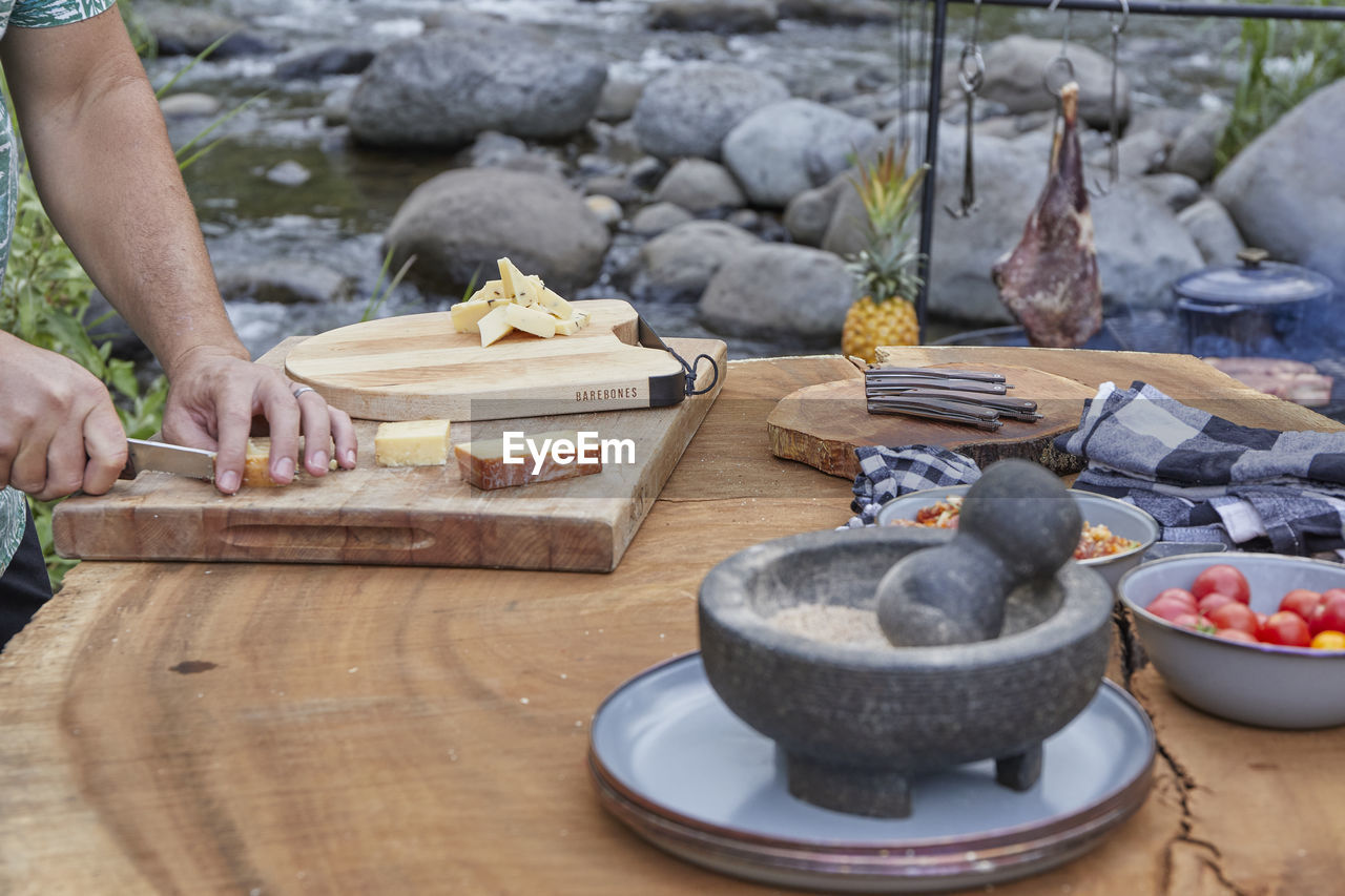 Charcuterie board being prepared at outdoor barbecue