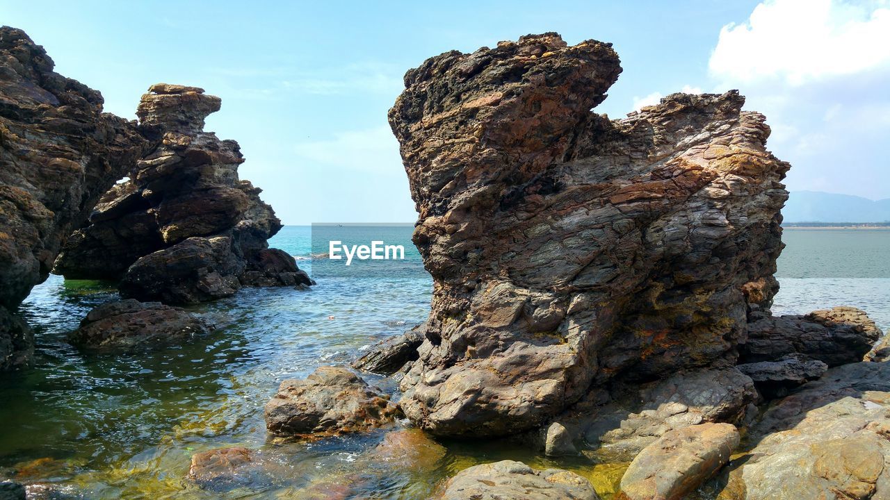 Scenic view of sea against blue sky