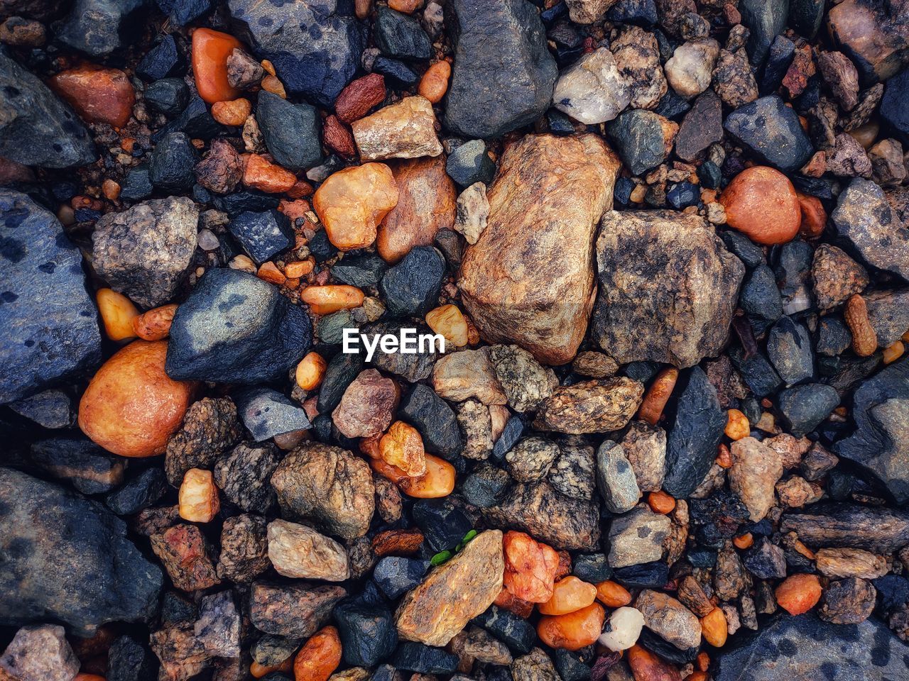 High angle view of stones on pebbles