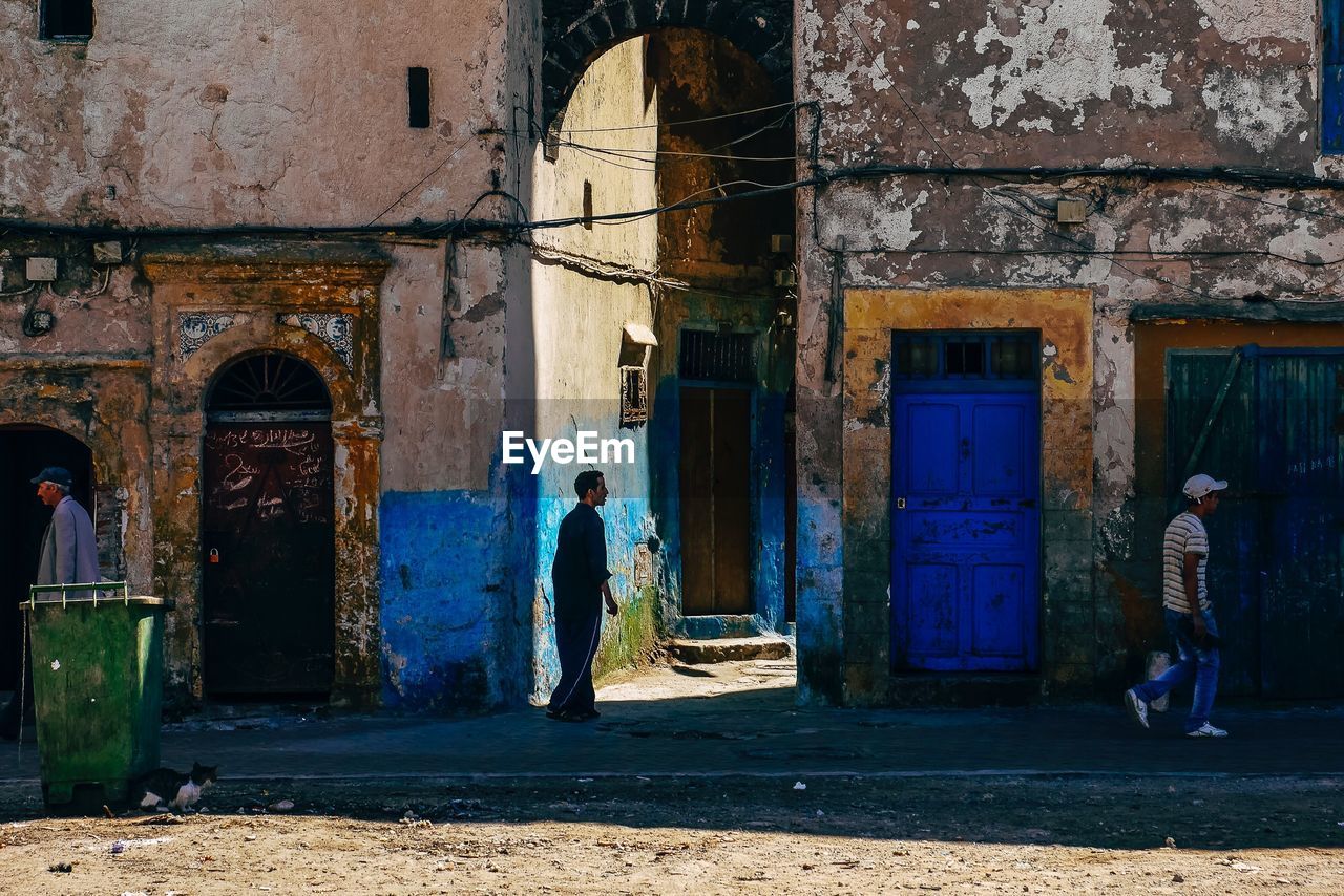 REAR VIEW OF WOMAN IN BUILDING