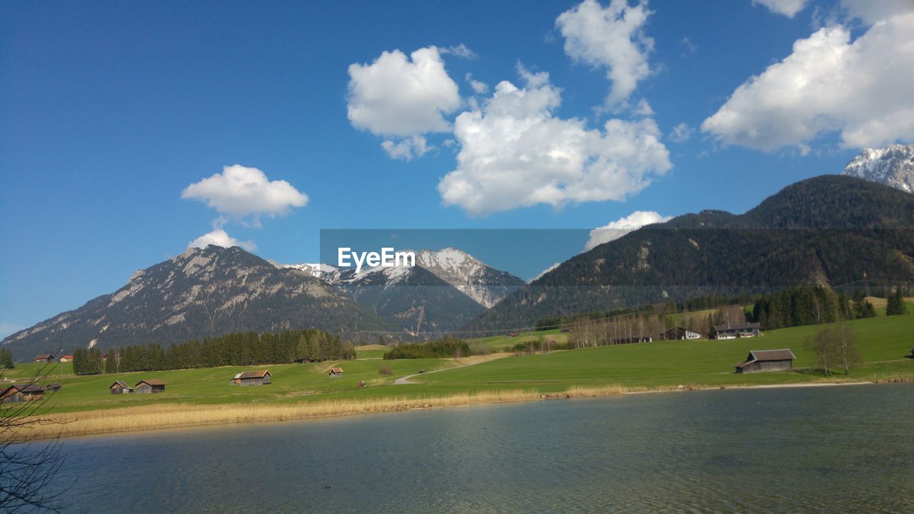 Scenic view of mountains against blue sky