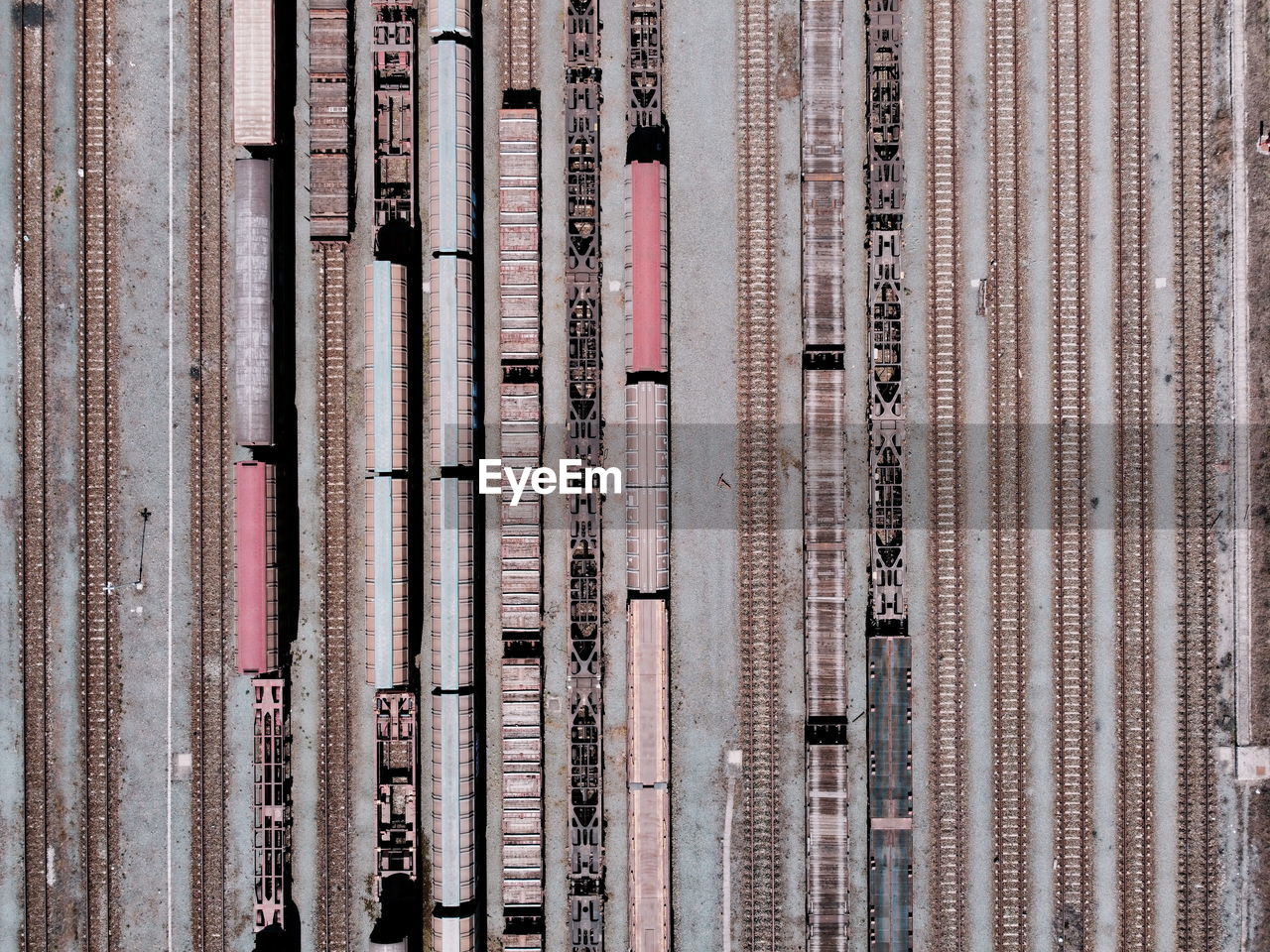 Aerial view from flying drone of trains on the railway station