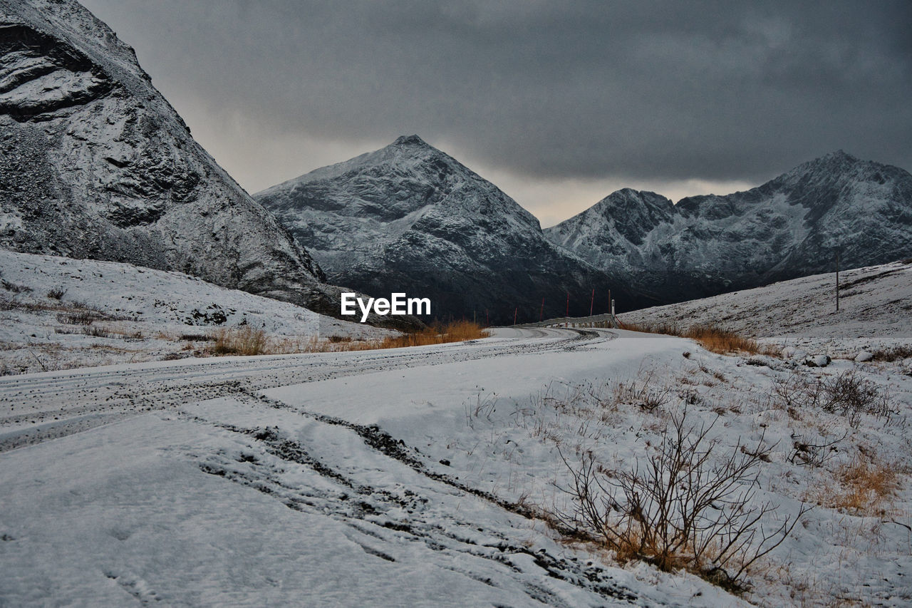 Beautiful view from the side of the road surrounded by icy mountains in brosmetinden, norway