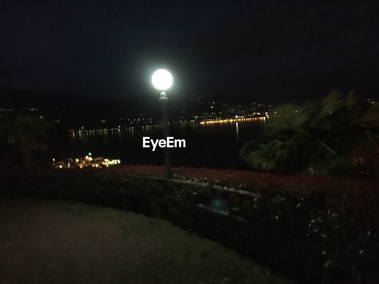 VIEW OF ILLUMINATED STREET LIGHT AT NIGHT