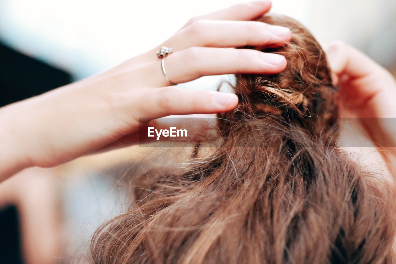 Cropped image of woman with hair bun