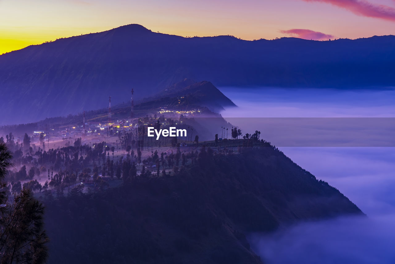 Low clouds at cemoro lawang village at sunrise at bromo tengger semeru national park,