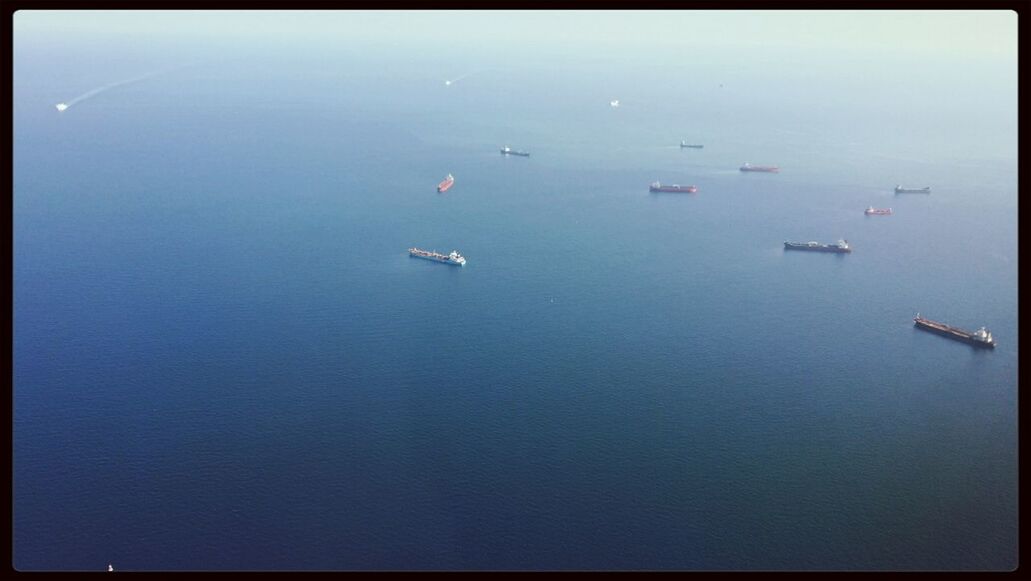 High angle view of boats moored in calm blue sea