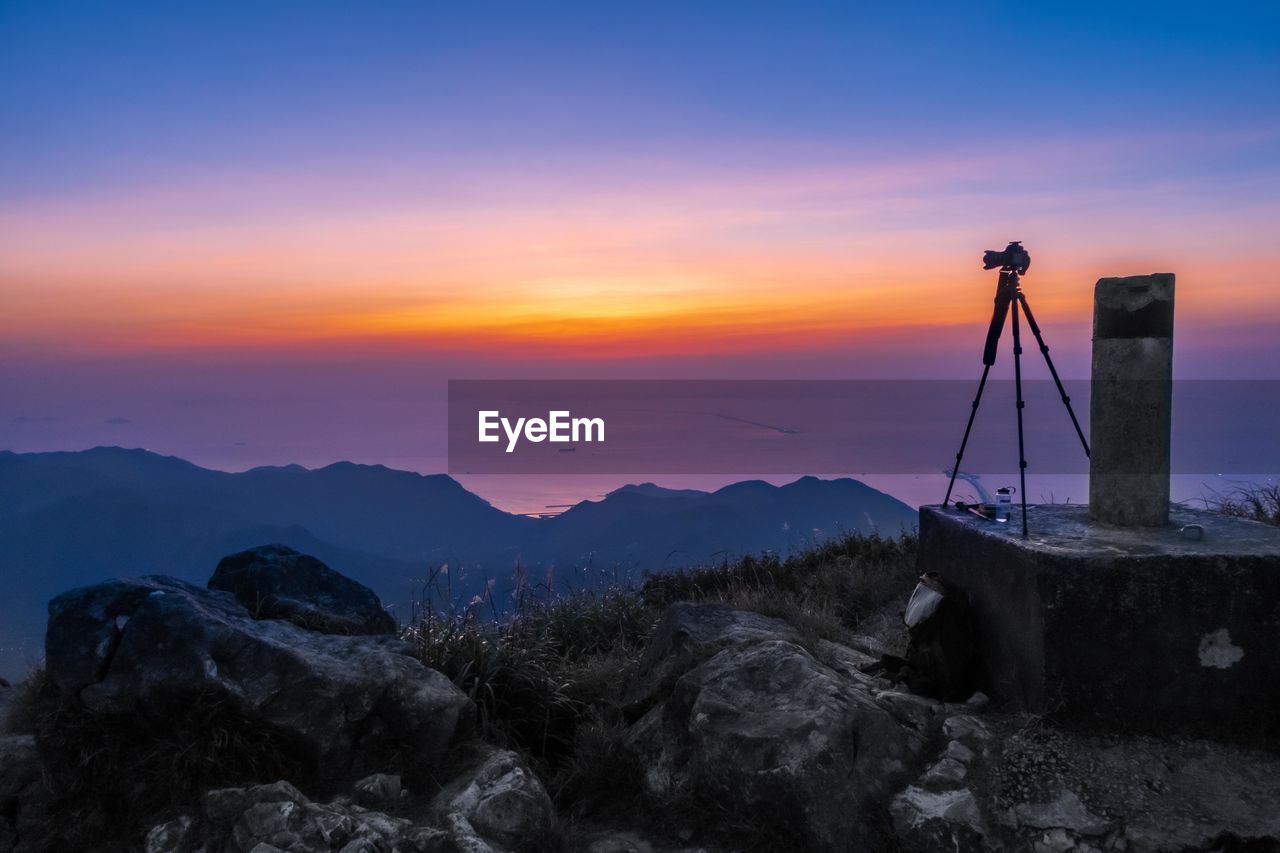 SCENIC VIEW OF MOUNTAIN AGAINST CLOUDY SKY