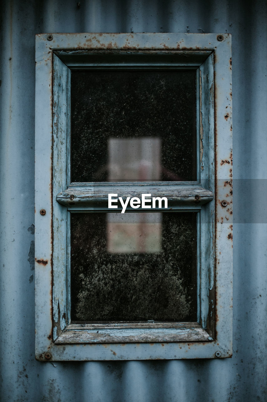 Close-up of rusty window