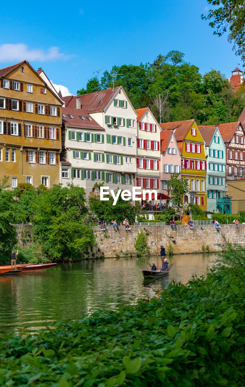 BUILDINGS BY RIVER AGAINST CITY