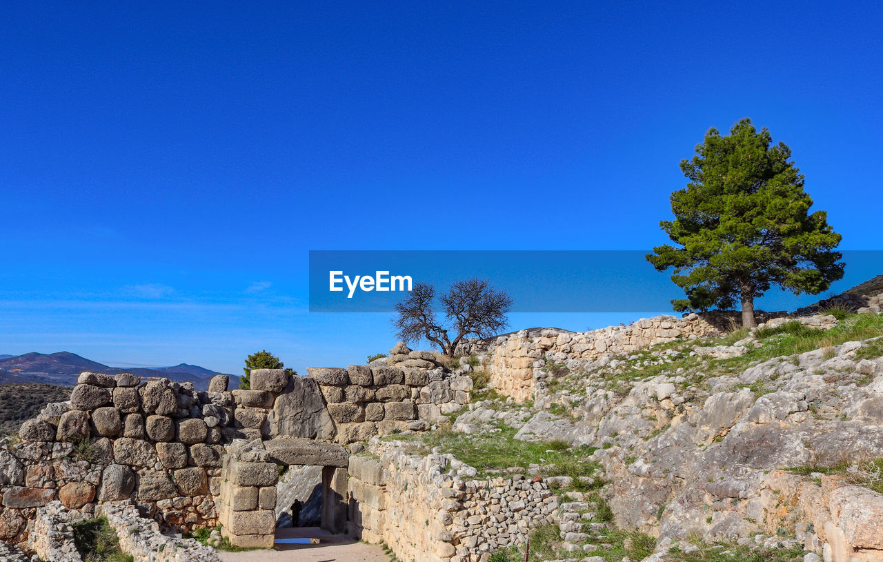 VIEW OF OLD RUIN AGAINST BLUE SKY