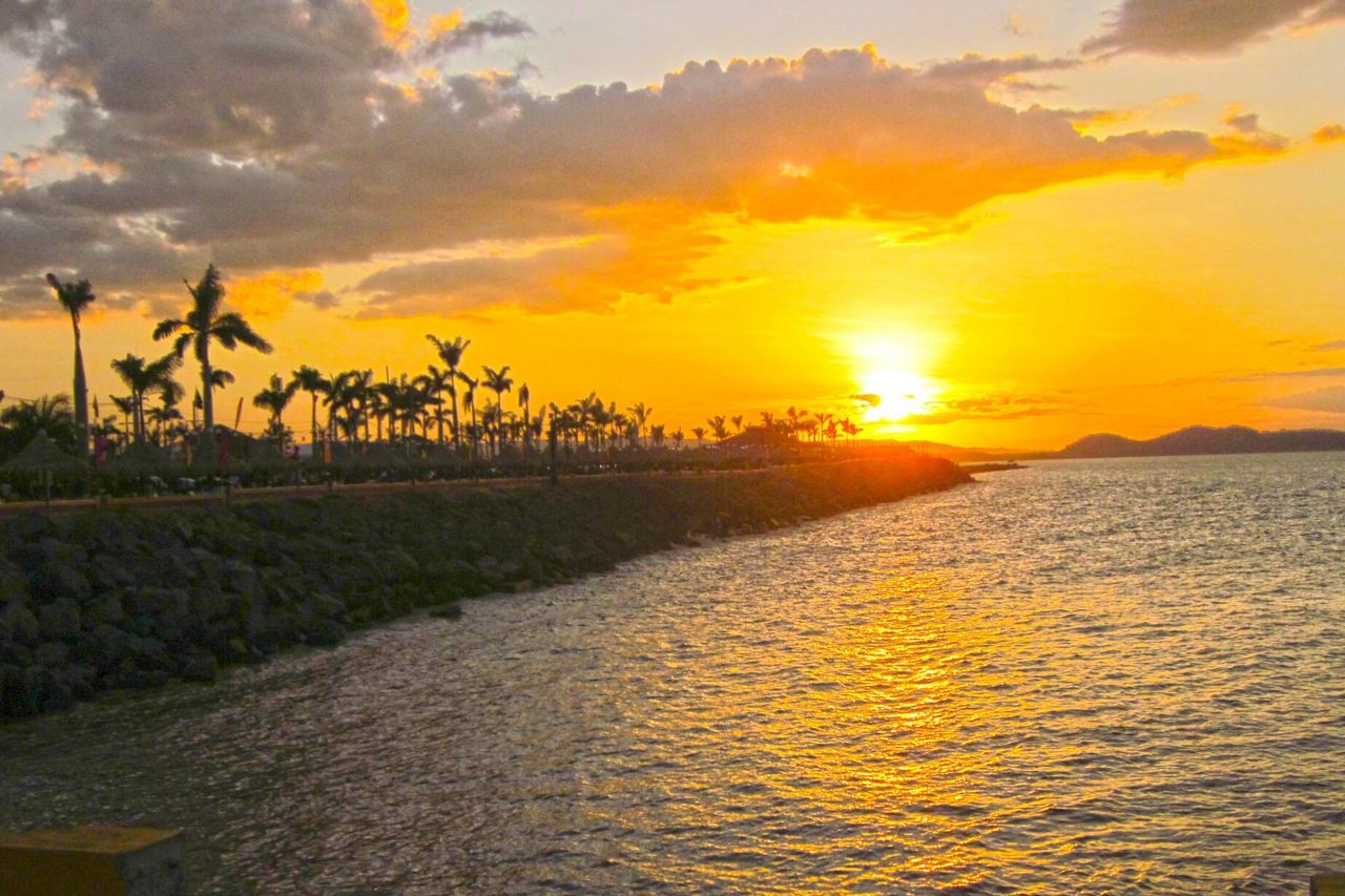 SCENIC VIEW OF SUNSET OVER SEA