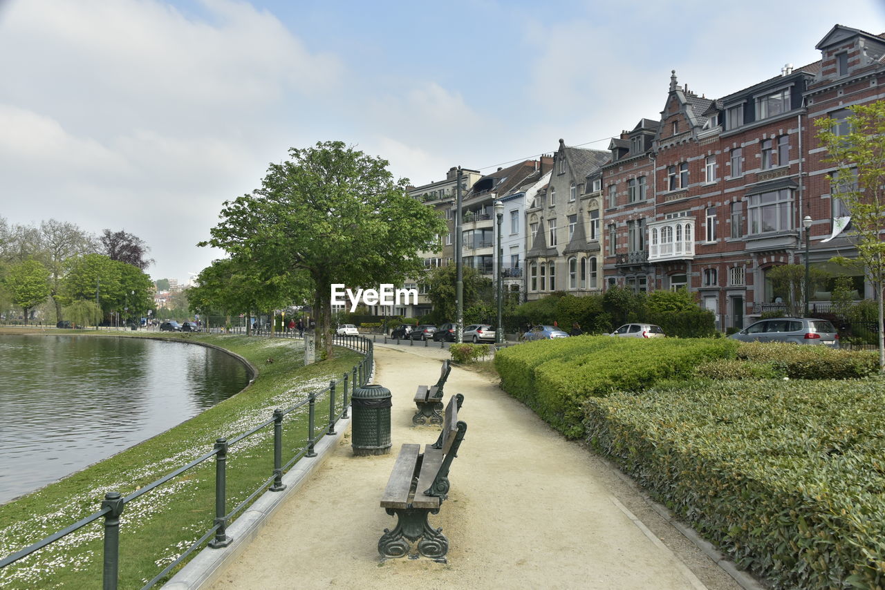 River amidst buildings against sky in city