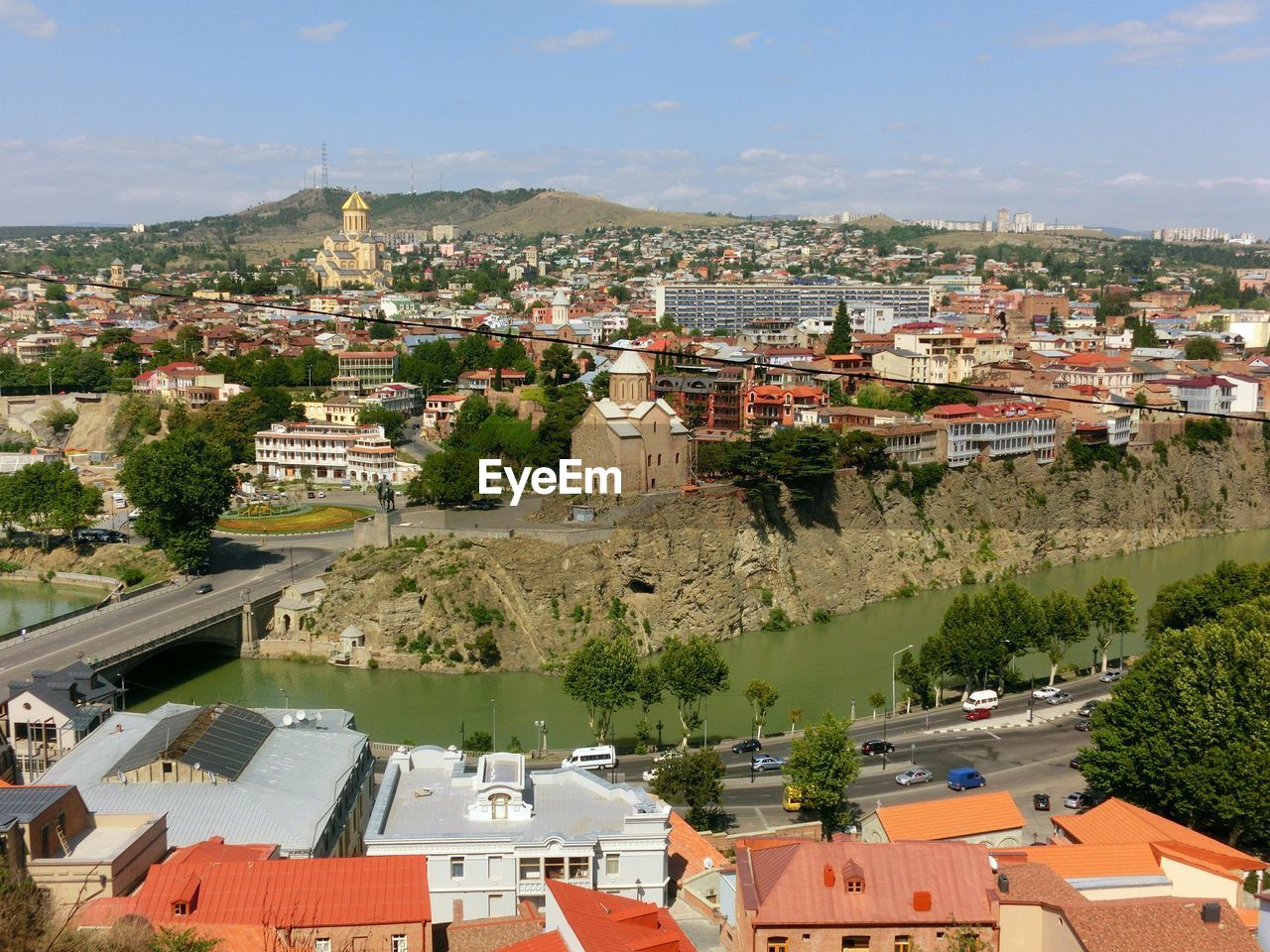 High angle view of houses in town against sky