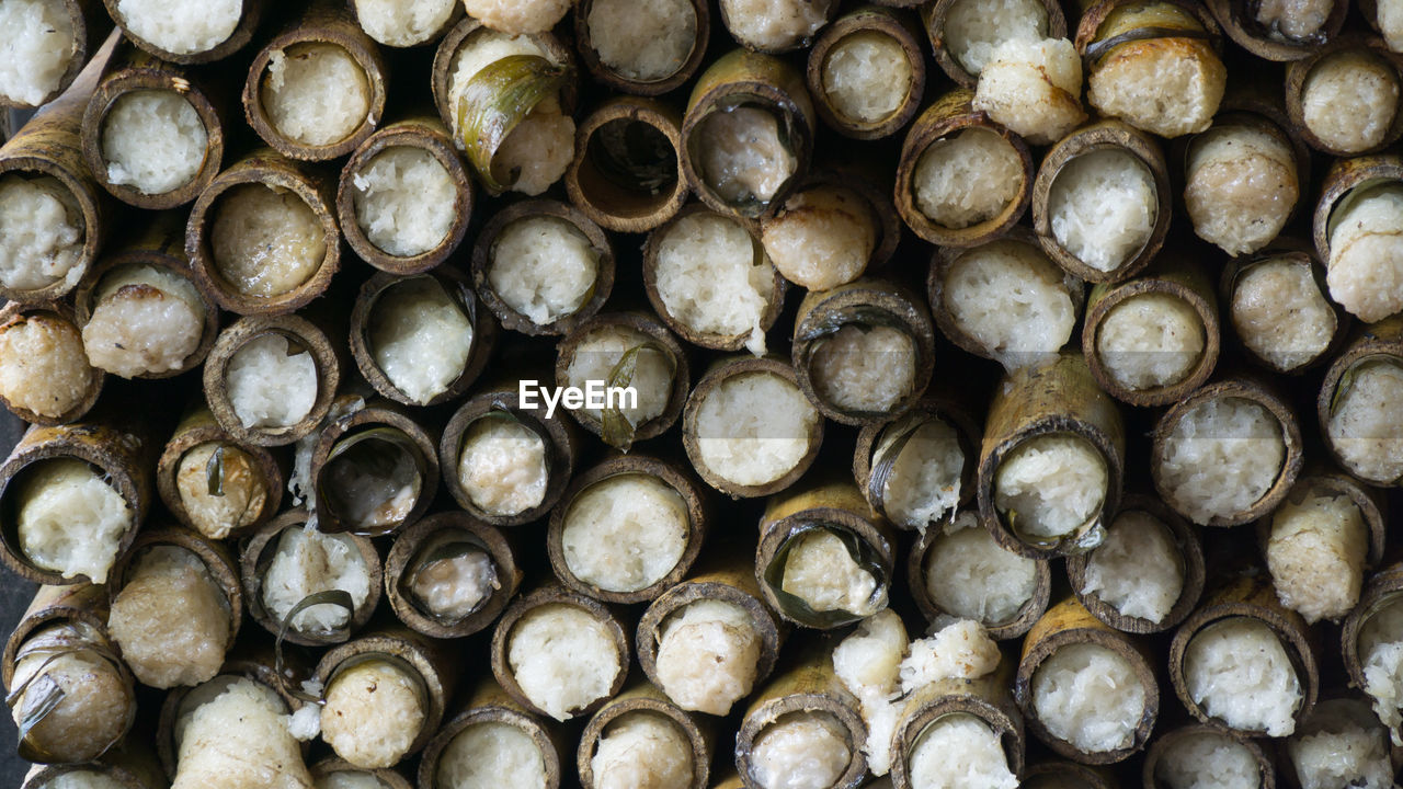 FULL FRAME SHOT OF STACK OF FIREWOOD