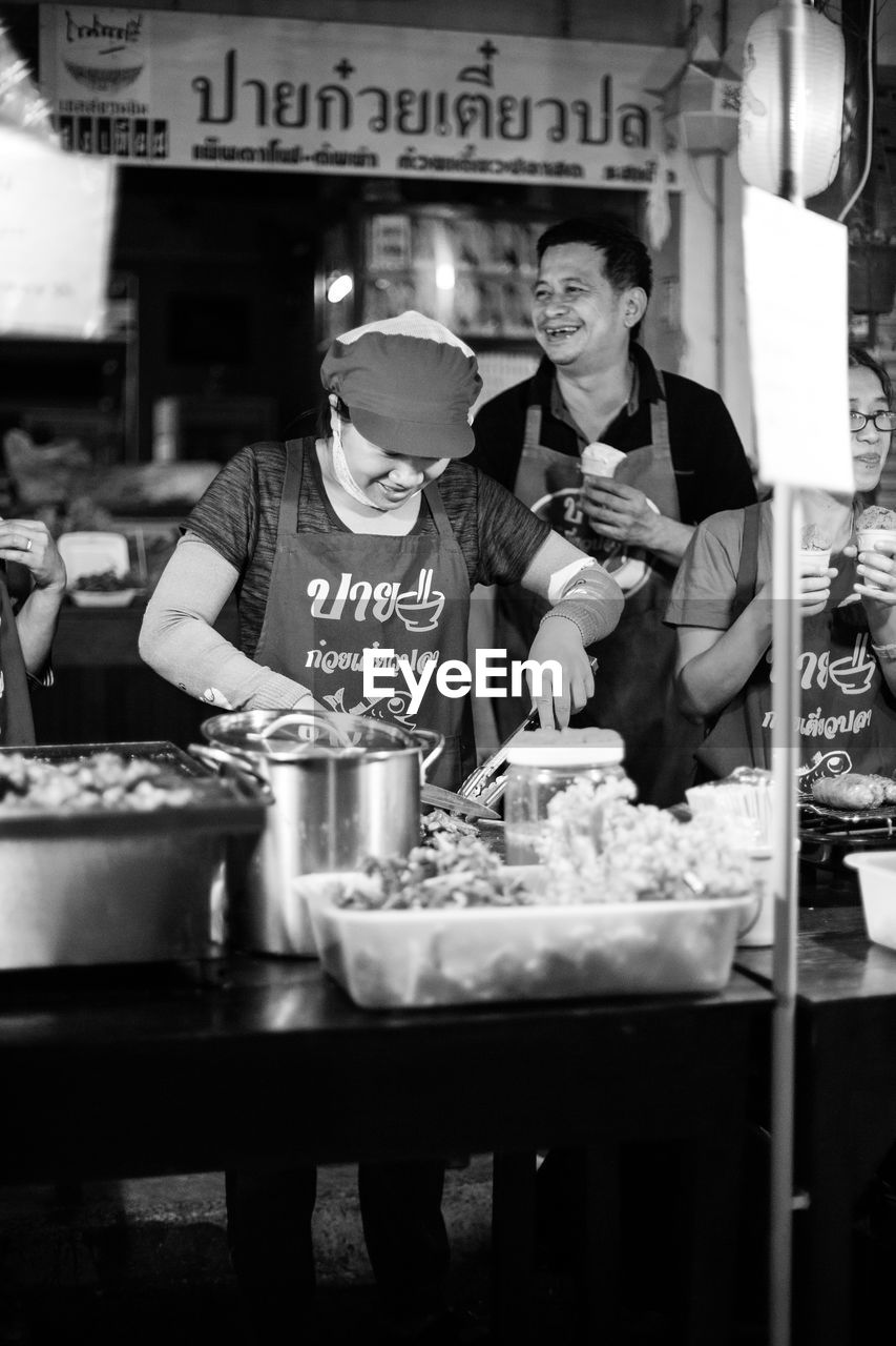 HIGH ANGLE VIEW OF PEOPLE IN CAFE