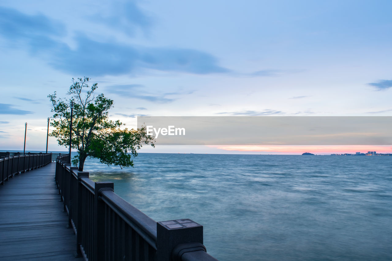 Scenic view of sea against sky at sunset