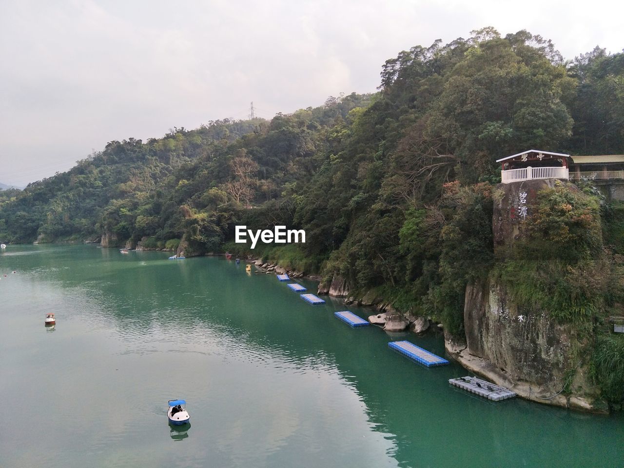 SCENIC VIEW OF LAKE AGAINST TREES