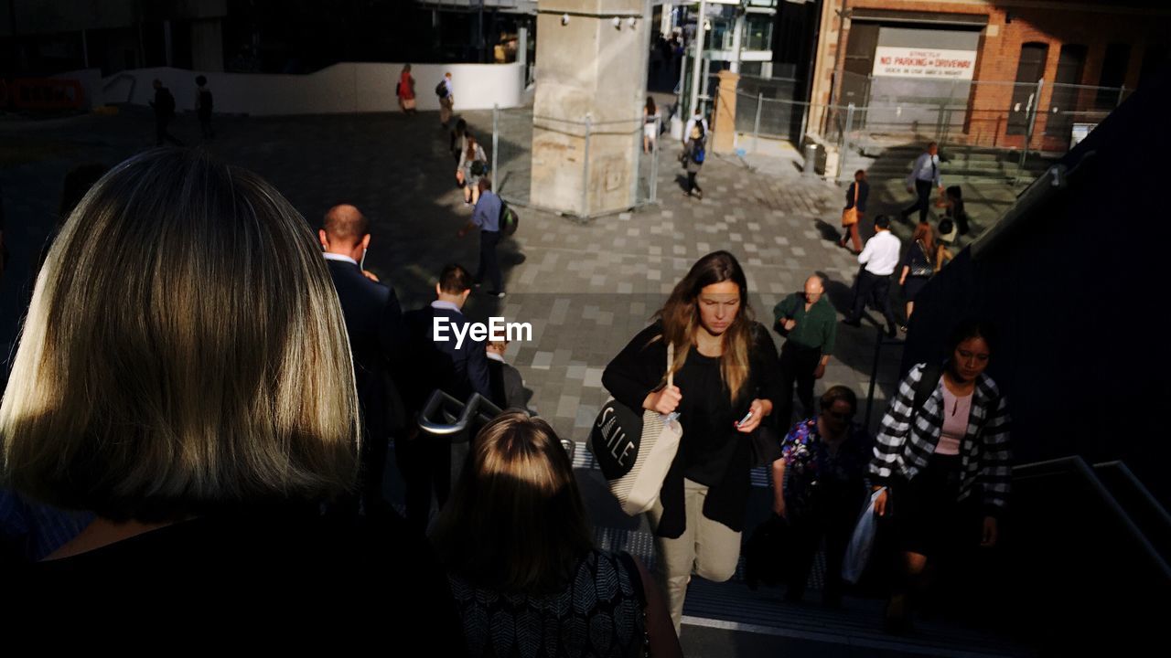 PANORAMIC VIEW OF PEOPLE STANDING ON STREET