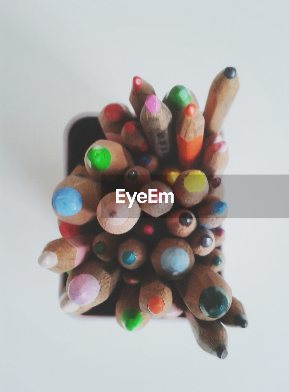 Close-up of pencils in desk organizer on table