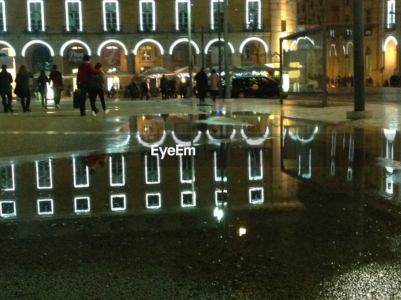 VIEW OF PEOPLE IN ILLUMINATED BUILDING