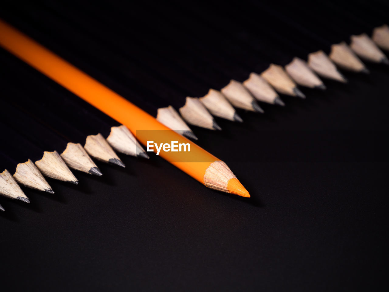 High angle view of pencils on black background