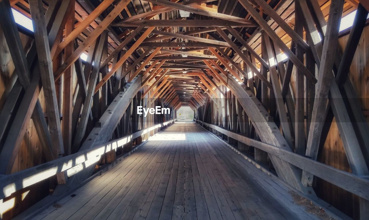 architecture, built structure, the way forward, diminishing perspective, bridge, indoors, transportation, no people, ceiling, wood, day, vanishing point, travel destinations, footpath, building, metal, arch, travel