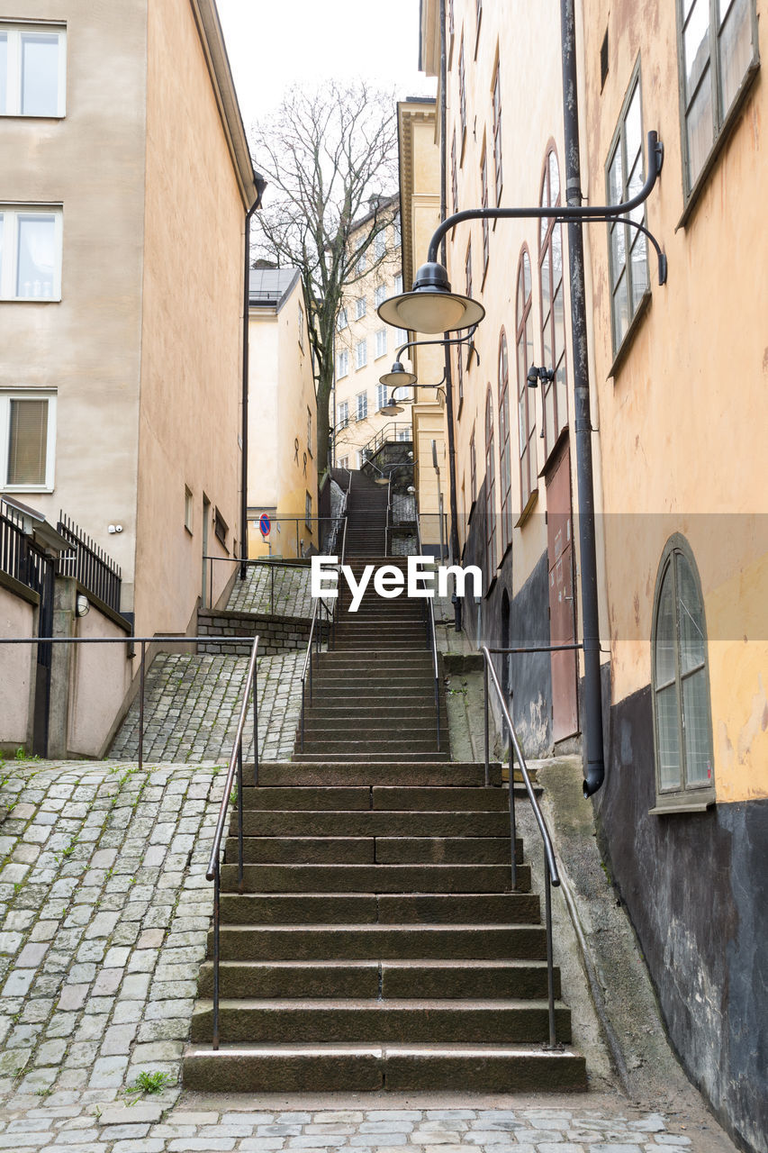 Staircase amidst buildings in city