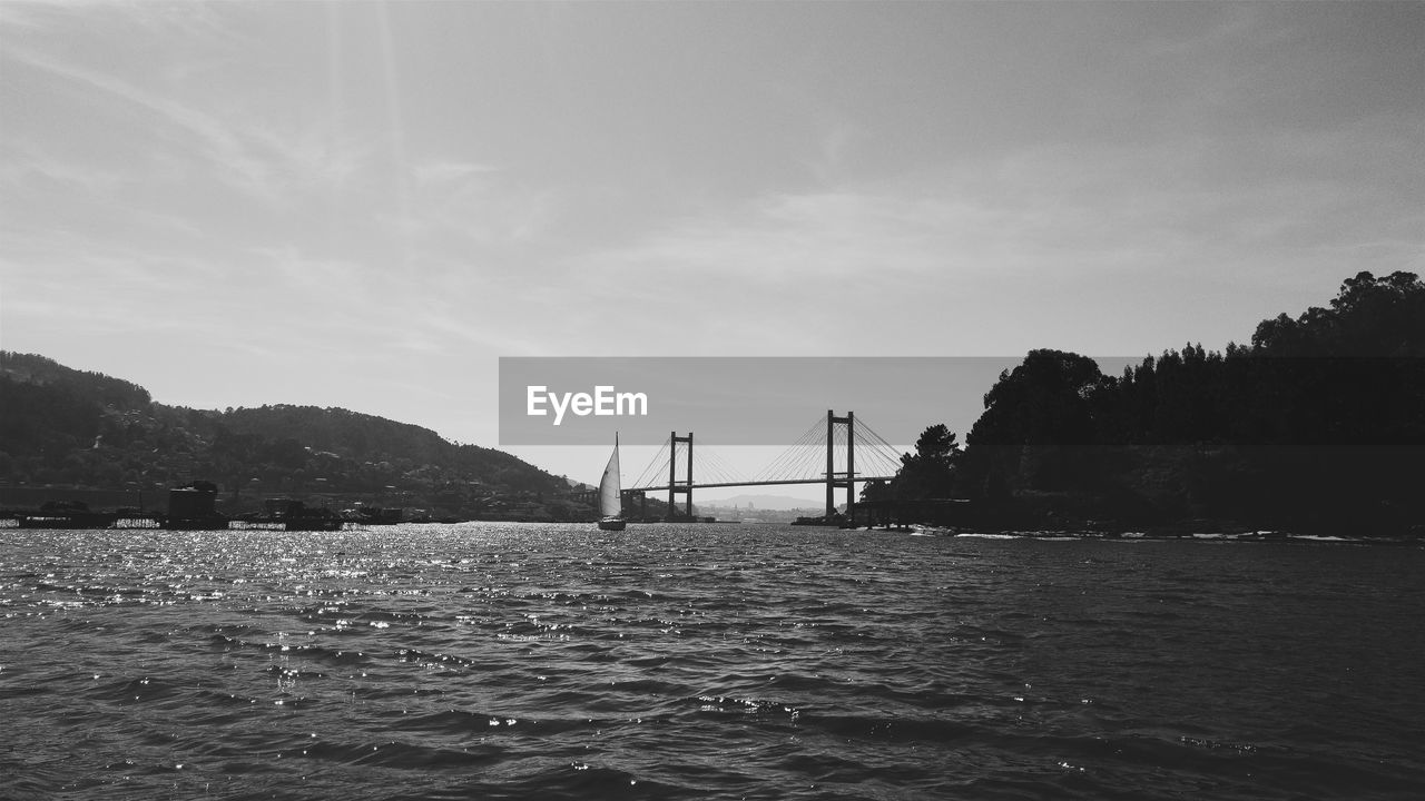 Bridge over sea against sky