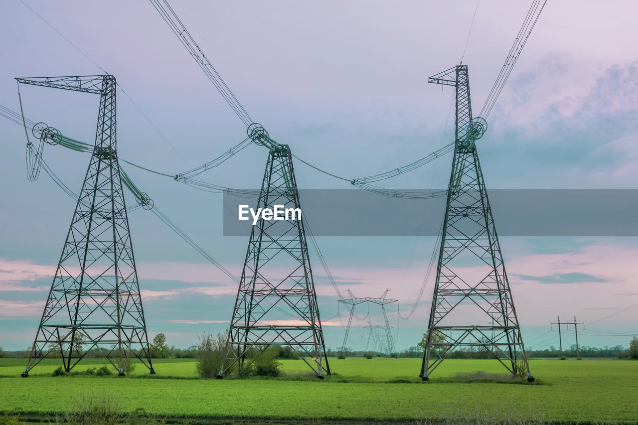 Group silhouette of transmission towers, power tower, electricity pylon, steel lattice tower 