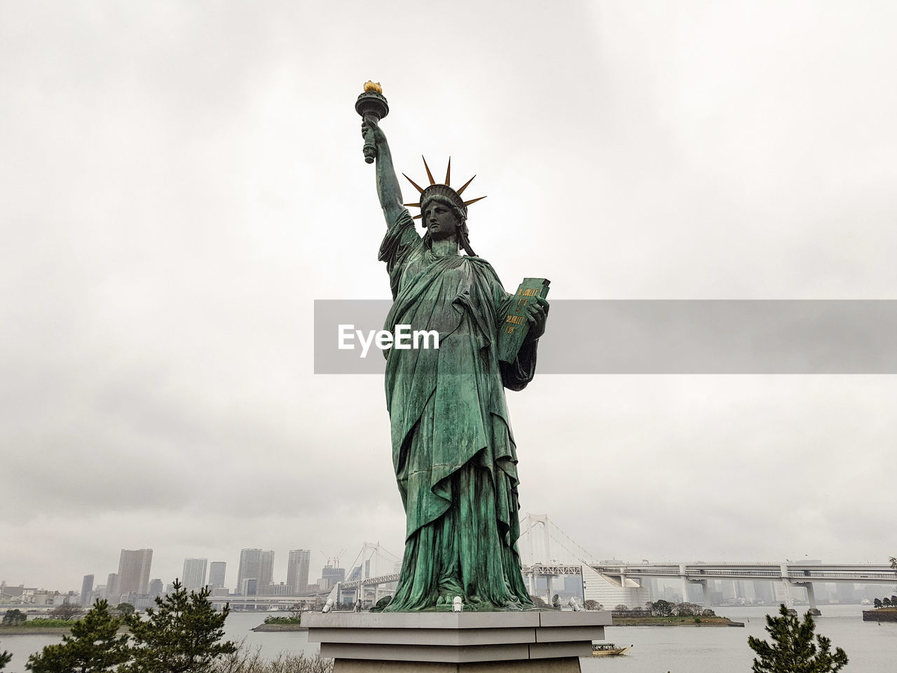 Statue of liberty against cloudy sky