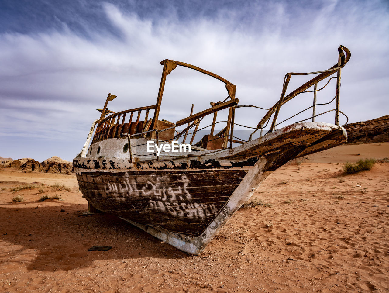 ABANDONED BOAT ON BEACH