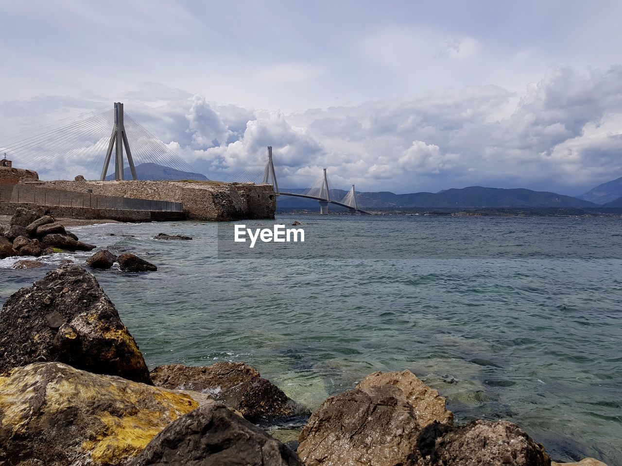 Sailboat on sea shore against sky