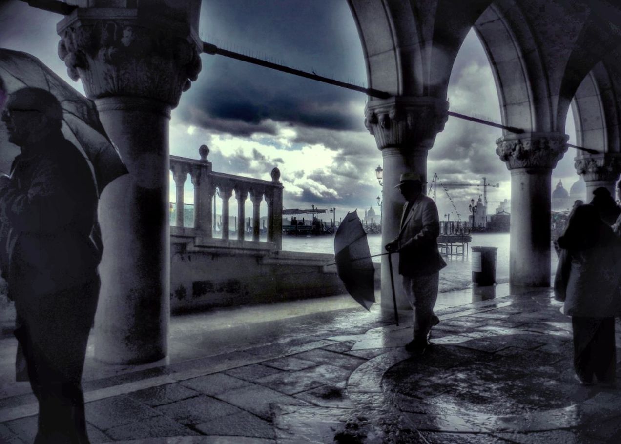 WOMAN STANDING ON CITY STREET